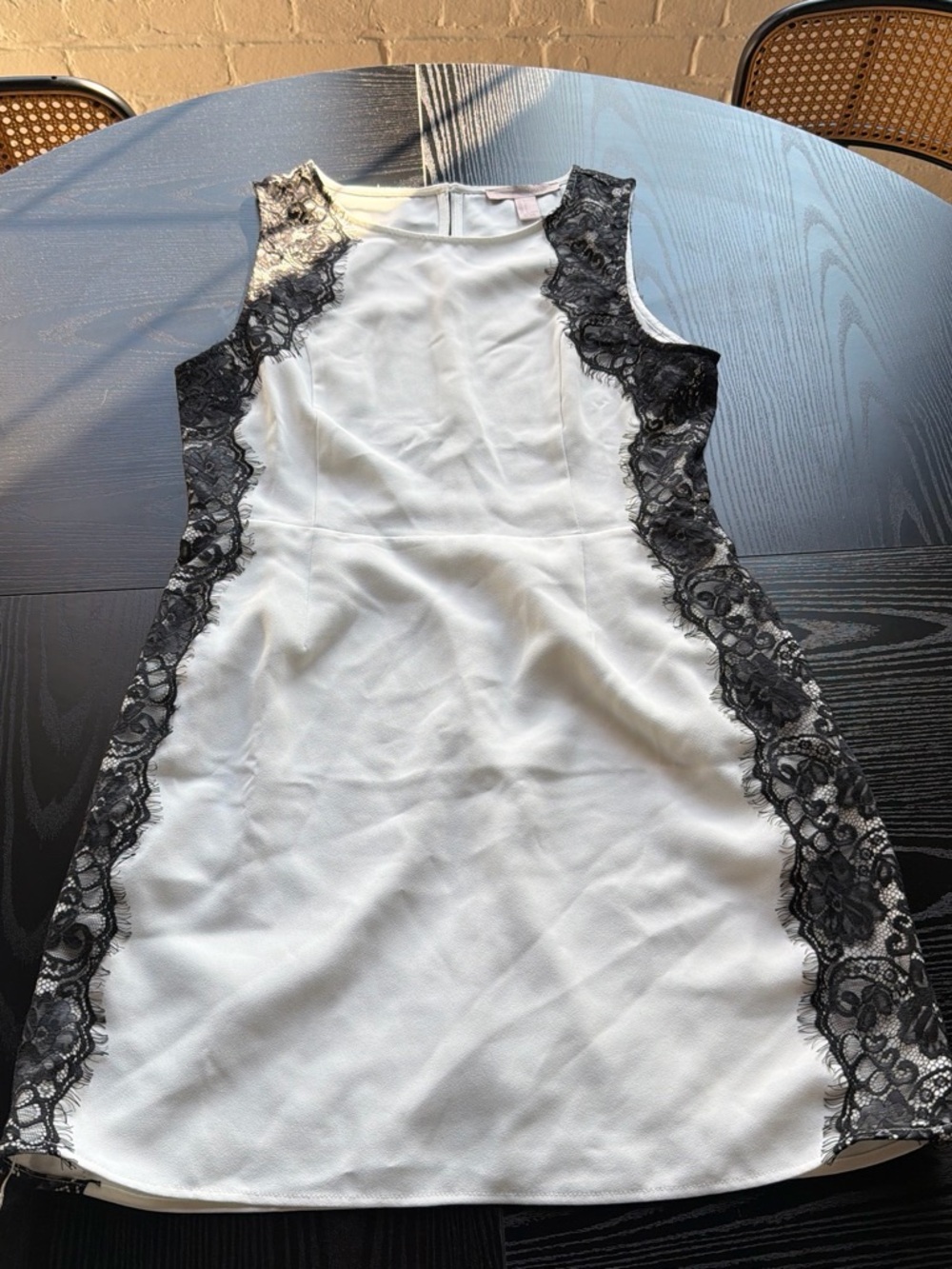 Sleeveless White Dress with Black Lace Side Panels